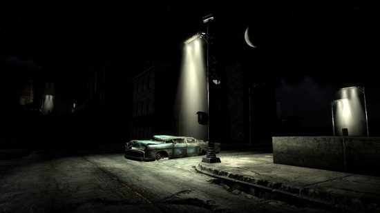 A streetlight sheds a cone of light over the wreckage of a car in Fallout 3 with the Street Lights mod, one of the best Fallout 3 mods, installed.