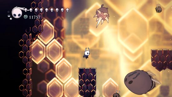 Best single player games - Hollow Knight: An in-game screenshot of the Knight jumping between platforms with enemies floating around.