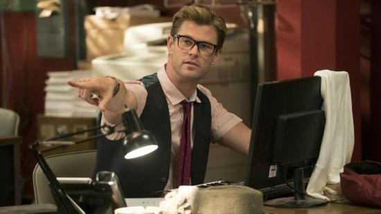 Get into games media: Chris Hemsworth, from the Ghostbusters movie, sits at a desk