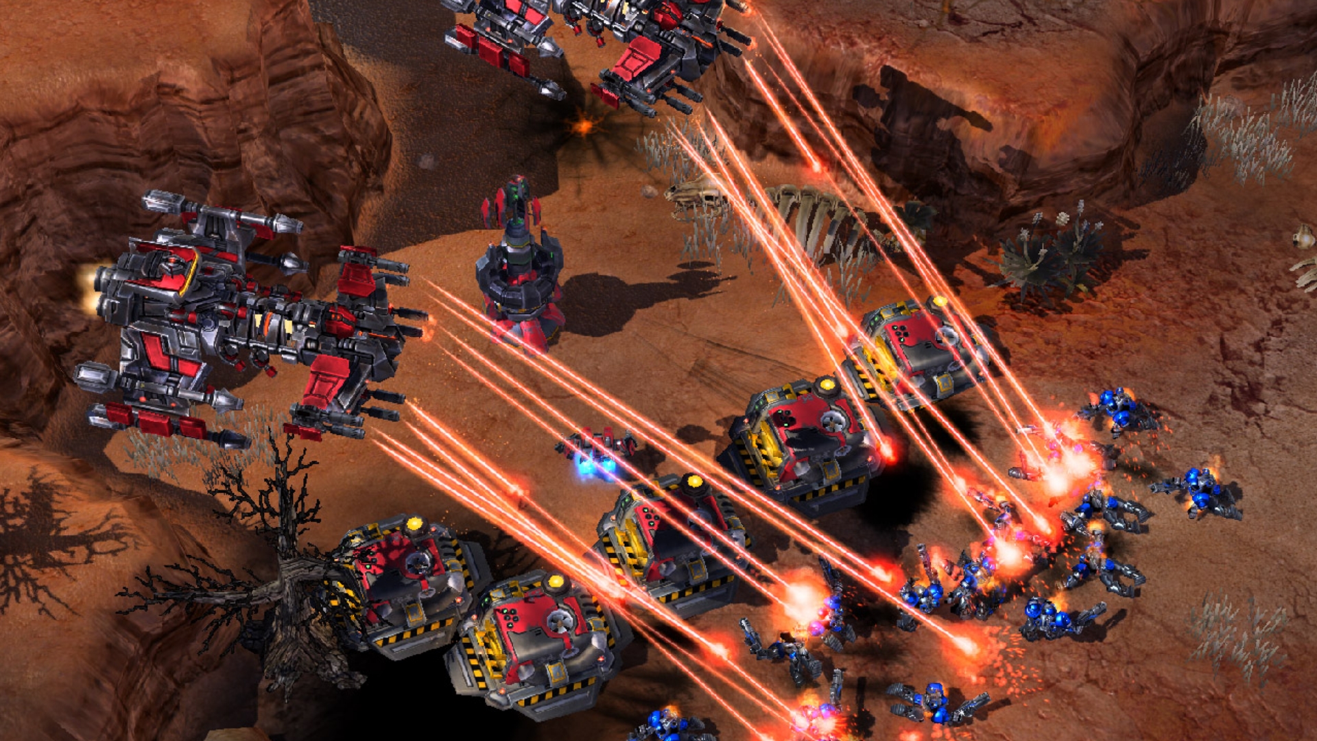 Best strategy games - two massive airships are roasting enemies with lasers in blue in StarCraft 2.