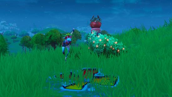 Fortnite search between giant rock man crowned tomato encircled tree location