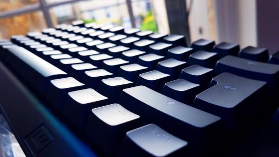 The best gaming keyboard lies horizonal as the window shines light on the keycaps