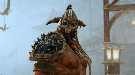 Best Medieval games - a barbarian in For Honor with a horned helmet with a skull face.