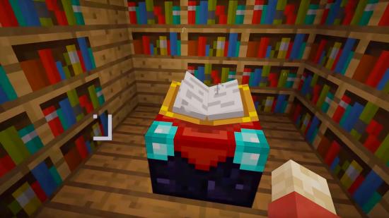 A Minecraft enchanting table in a room lined by bookshelves
