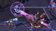 Tracer and Zarya take on a Tauren in one of the best free PC games, Heroes of the Storm