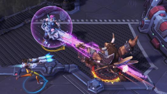 Tracer and Zarya take on a Tauren in one of the best free PC games, Heroes of the Storm