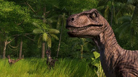 A raptor staring into the camera menacingly in Jurassic World Evolution