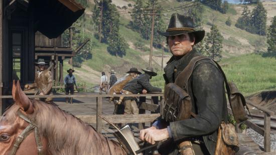 A cowboy riding a horse into town