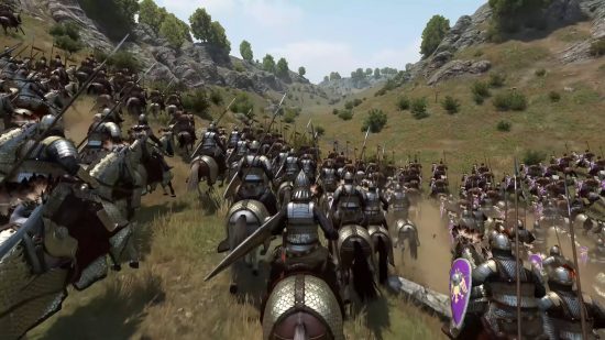 Bannerlord cheats - troops are galloping through a valley towards a distant enemy on horseback.