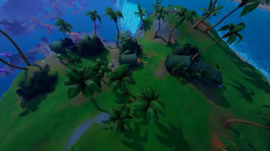 Top down view of a green hill covered in trees and a crashed plane in Fortnite