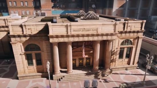 An exterior shot of Rainbow Six Siege's bank level, which is a classical-style, sandstone building in a modern city