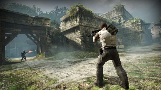 CS;GO's Aztec map, with ancient stonework, a crumbling bridge, and an armed character shooting aiming a rifle into the distance