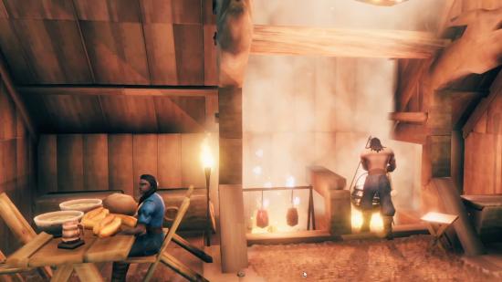 A man stands over a cauldron, cooking, while a woman sits at a table in Valheim