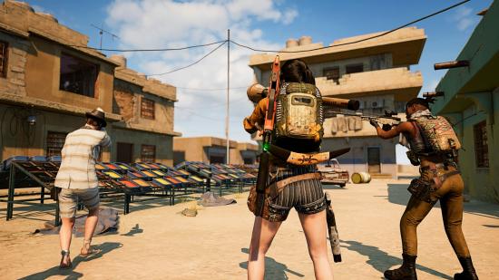 Three PUBG players take to battle in a desert town