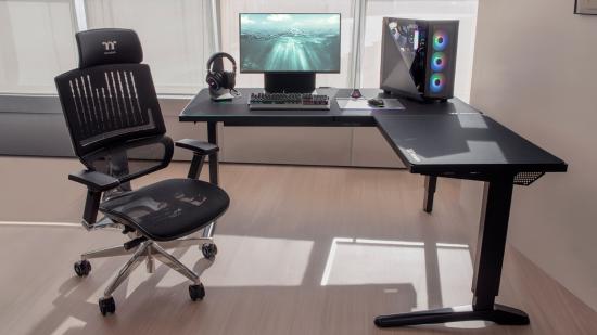 Thermaltake's height adjustable L-shaped ToughDesk 500L holds a monitor and a gaming PC on top of it