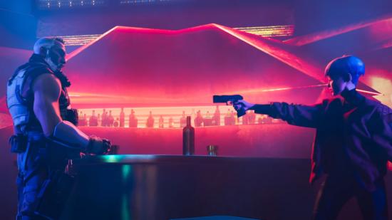 Valk pointing a gun at Kuben Blisk in a colourful bar