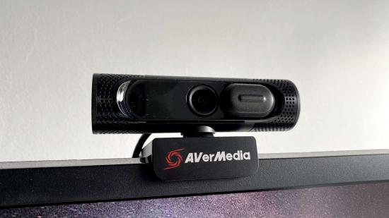 Avermedia's black webcam placed upon a thick-bezelled monitor