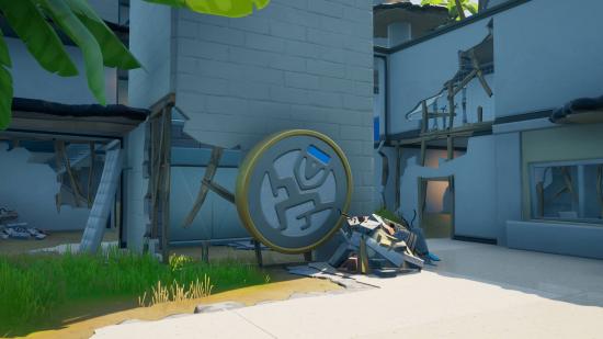 The Fortnite Ghost Ruins has an emblem dislodged from the wall among the dilapidated walls.