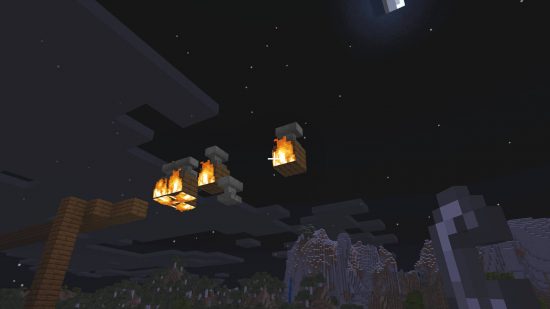 Minecraft Anvil食譜 - 幾隻即將掉落的砧，因為下面的木塊正在燃燒。
