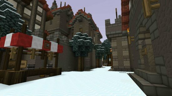 Best Minecraft maps - the Oakhold map is a snow-covered town with medieval style buildings.