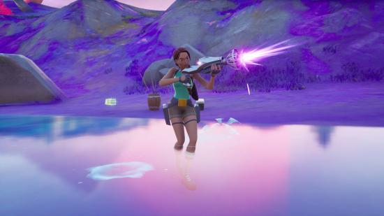 Lara is firing the Kymera Ray Gun, one of the four Fortnite alien weapons.