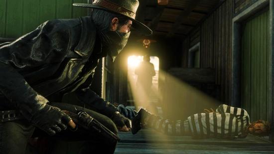 A Red Dead Online player looks towards a criminal in jail