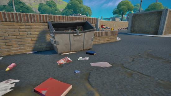 A book on explosives sitting by a dumpster in Dirty Docks in Fortnite. It's a blue book.