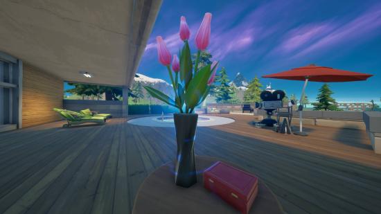 A vase of pink flowers sitting on a table in Fortnite