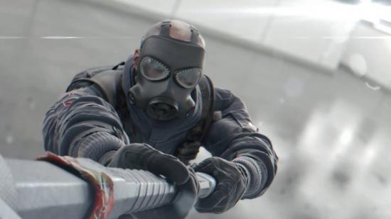 Sledge using a mallet to take out a security camera. He's one of the Rainbow Six Siege operators getting nerfed in Crystal Guard.