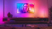 Philips Hue lighting shines brightly behind a Philips branded television, mimicking what's on screen
