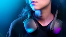 A woman wears the Roccat Syn Pro Air wireless gaming headset around her neck