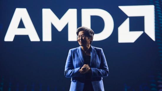 AMD President and CEO, Lisa Su, standing in front of a bright white AMD logo