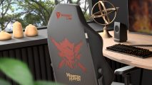 The back of a Secretlab Titan Evo 2022 Monster Hunter Edition gaming chair tucked under a wooden desk