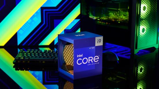 Intel's Alder Lake Core i9-12900K processor, boxed, amidst PC gaming paraphernalia