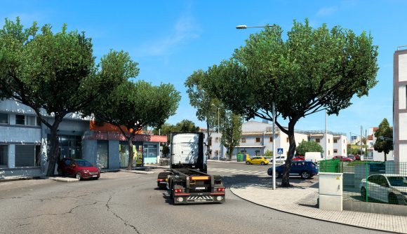 Driving down city street in Euro Truck Simulator 2