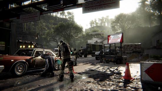 A soldier holds a driver at gunpoint at a Russian military checkpoint in Ghost Recon Breakpoint: Operation Motherland.