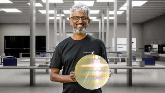 Intel's Raja Koduri holding a chip wafer