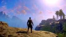 A New World character stands on a clifftop looking out at distant mountains