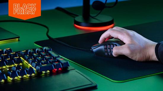 A hand clutches a mouse as someone uses a PC they may have bought in a Black Friday sale.
