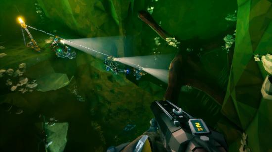 Dwarves travel along an underground zip line over a chasm in Deep Rock Galactic.