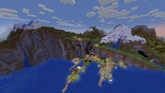 Best Minecraft seeds: a Minecraft village built into the side of a huge seaside cliff, with a snowy mountain behind it