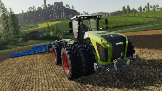 Best farming games - A realistic green tractor plows fields in Farming Simulator 22.
