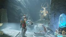 Exploring a cave as Kratos in our God of War PC review