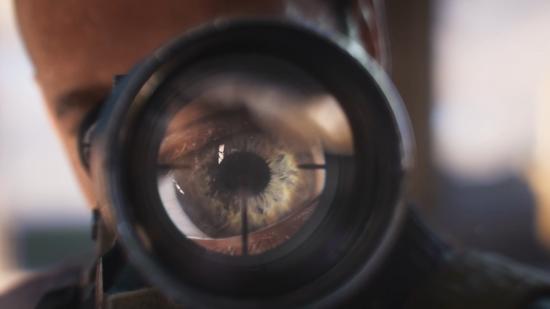 A sniper's eye is seen close up through the front of a high-magnification scope in Sniper Elite 5.