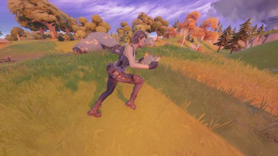 The player is carrying Drake's map in Fortnite and is running towards the treasure.