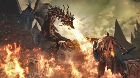 Best games like Monster Hunter: a dragon breathing fire from the top of a castle while a knight looks on in Dark Souls 3.