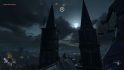 Looking up at a full moon poking through the clouds while standing atop a cathedral in our Dying Light 2 review