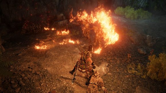 Breathing fire at a group of soldiers in a cave in Elden Ring