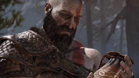 Kratos looks down sadly in God of War