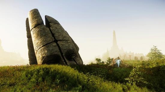 The head of a stature towers above the hills in New World